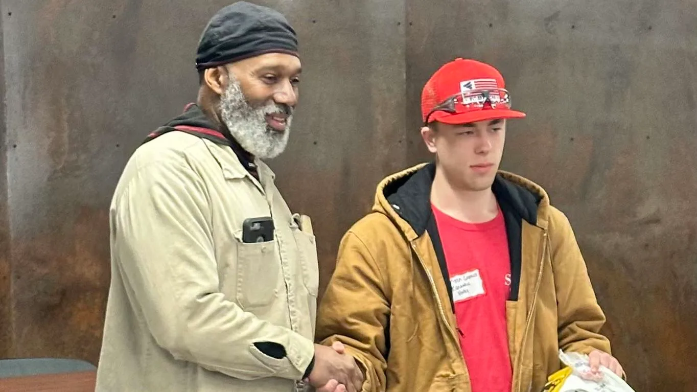 student welder and instructor